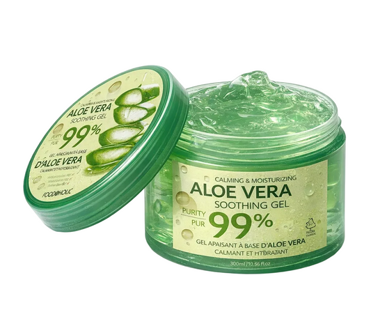 Aloe vera soothing gel with a green jar and aloe vera leaves on a white background